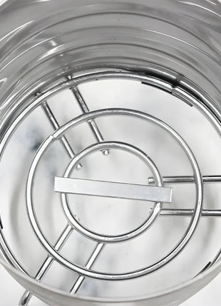 Close-up of stainless steel charcoal holder interior with grill structure